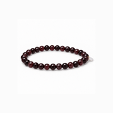 Essential Garnet stretch bracelet with deep wine-red natural stone beads and a small mother-of-pearl accent