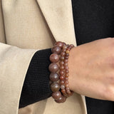 Chunky Purple Brown Aventurine bracelet stacked with the Essential and Petite styles, worn with a beige blazer