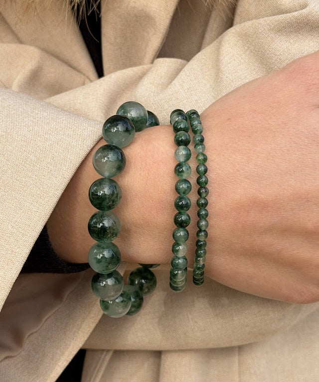 Essential Green Moss Agate bracelet in a stack with the Chunky and Petite styles, worn with a beige coat