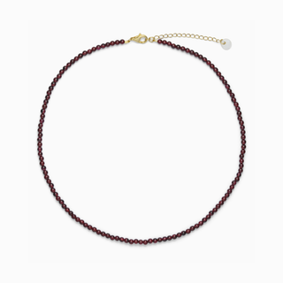 Luna Garnet necklace with fine deep red garnet beads, on a white background