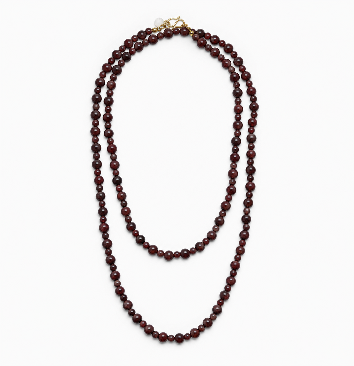 Lea Garnet necklace laid out double, showing its long strand of dark red natural stone beads